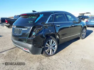 2024 Cadillac XT5 FWD Premium Luxury with VIN 1GYKNCRS4RZ729461, listed as a IAAI auction lot 41411300 with 5,760 mi miles. Bid and sale history available at carsss.com. Image 4.
