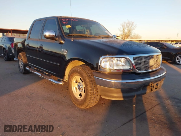 2002 Ford F-150 XLT with VIN 1FTRW07622KD31203, listed as a IAAI auction lot 41401506 with 166,949 mi miles. Bid and sale history available at carsss.com. Image 1.