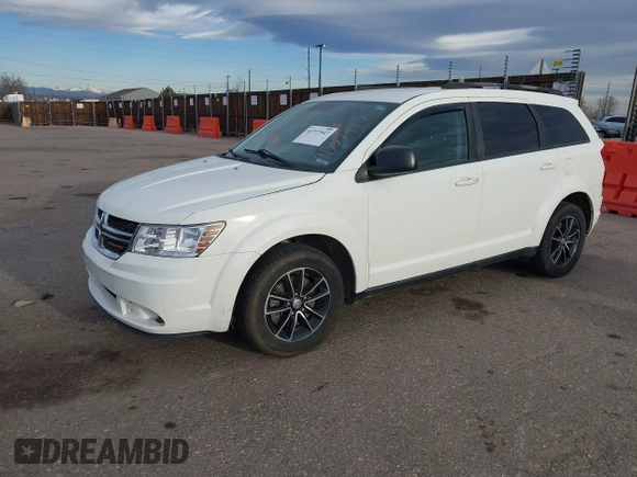2017 Dodge Journey SE with VIN 3C4PDCAB6HT670624, listed as a IAAI auction lot 41777947 with 143,496 mi miles and . Bid and sale history available at DreamBid. Image 2.
