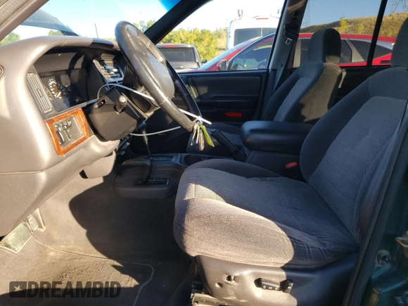 1997 Jeep Grand Cherokee Laredo with VIN 1J4GZ58Y6VC647434, listed as a Copart auction lot 73496824 with 124,946 mi miles and Salvage Title. Bid and sale history available at carsss.com. Image 7.