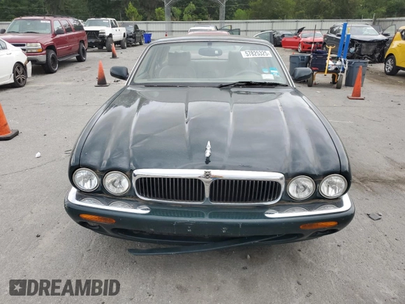 1999 Jaguar XJ with VIN SAJHX1044XC865054, listed as a Copart auction lot 57825325 with 71,145 mi miles and Clean title. Bid and sale history available at DreamBid. Image 5.