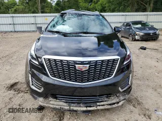 2023 Cadillac XT5 FWD Luxury z VIN 1GYKNAR40PZ106096, wystawiony jako Copart lot #80909074 z przebiegiem 19 677 mil mil oraz Nie do naprawy • Non repairable. Historia ofert i sprzedaży dostępna na DreamBid. Obrazek 5.