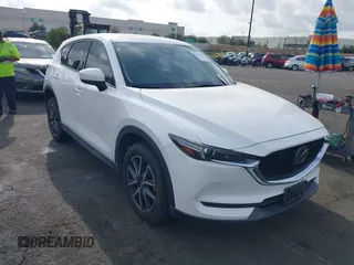 2018 Mazda CX-5 Grand Touring with VIN JM3KFADMXJ0470846, listed as a IAAI auction lot 41913533 with 54,700 mi miles and . Bid and sale history available at DreamBid. Image 1.