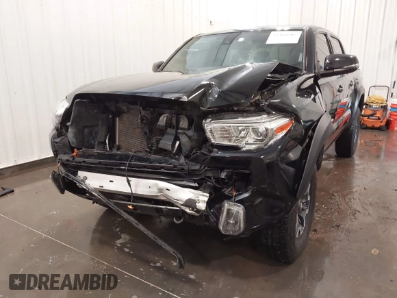 2019 Toyota Tacoma SR with VIN 5TFCZ5AN7KX167511, listed as a IAAI auction lot 42360585 with 65,213 mi miles and . Bid and sale history available at DreamBid. Image 6.