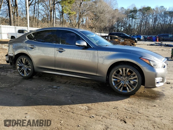 2019 Infiniti Q70 Luxe with VIN JN1BY1AR7KM580088, listed as a Copart auction lot 41612865 with 101,134 mi miles and Salvage title. Bid and sale history available at DreamBid. Image 4.