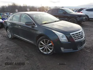 2014 Cadillac XTS Luxury z VIN 2G61N5S33E9270625, wystawiony jako IAAI lot #41235667 z przebiegiem 150 000 mil mil oraz . Historia ofert i sprzedaży dostępna na DreamBid. Obrazek 1.