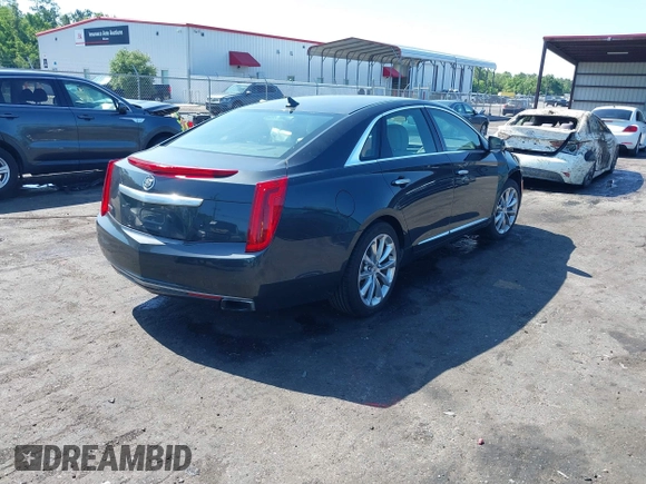 2014 Cadillac XTS Luxury z VIN 2G61M5S37E9211547, wystawiony jako IAAI lot #42373128 z przebiegiem 146 354 mil mil oraz . Historia ofert i sprzedaży dostępna na DreamBid. Obrazek 4.