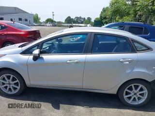 2019 Ford Fiesta SE z VIN 3FADP4BJ0KM133096, wystawiony jako IAAI lot #42204601 z przebiegiem 108 904 mil mil oraz . Historia ofert i sprzedaży dostępna na DreamBid. Obrazek 14.