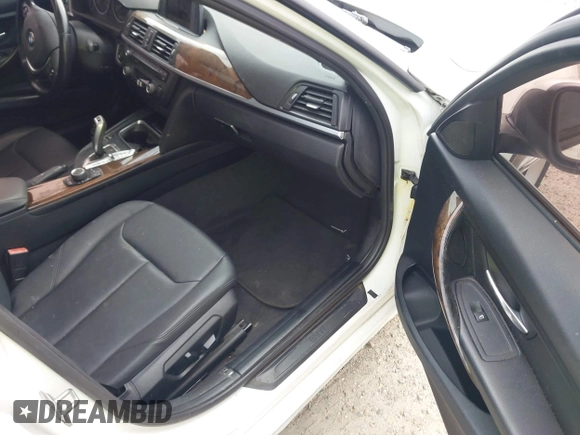 2015 BMW 3 Series 328i with VIN WBA3A5C50FF608327, listed as a IAAI auction lot 42136156 with 213,945 mi miles. Bid and sale history available at carsss.com. Image 5.