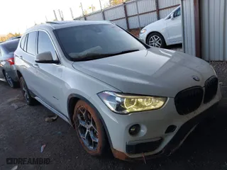 2018 BMW X1 xDrive28i with VIN WBXHT3C32J5K29627, listed as a IAAI auction lot 40995212 with NaN miles. Bid and sale history available at carsss.com. Image 1.