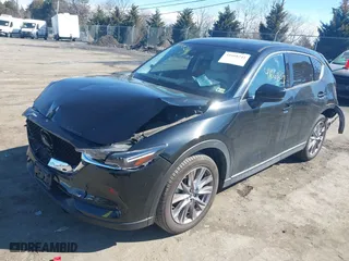 2019 Mazda CX-5 Grand Touring with VIN JM3KFBDM2K0603297, listed as a IAAI auction lot 41668241 with 54,583 mi miles. Bid and sale history available at carsss.com. Image 2.
