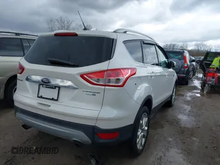 2016 Ford Escape Titanium with VIN 1FMCU9JX9GUA62674, listed as a IAAI auction lot 41838996 with 135,105 mi miles. Bid and sale history available at carsss.com. Image 4.