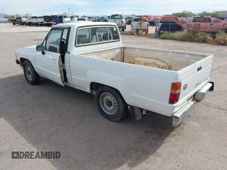 1991 Toyota Pickup DX z VIN JT4RN81P8M5123864, wystawiony jako IAAI lot #38084991 z przebiegiem 319 627 mil mil oraz . Historia ofert i sprzedaży dostępna na DreamBid. Obrazek 3.