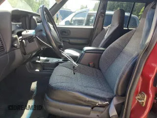 1999 Jeep Cherokee Sport z VIN 1J4FF68SXXL525944, wystawiony jako Copart lot #57653905 z przebiegiem 102 057 mil mil oraz Szkoda całkowita • Salvage title. Historia ofert i sprzedaży dostępna na DreamBid. Obrazek 7.