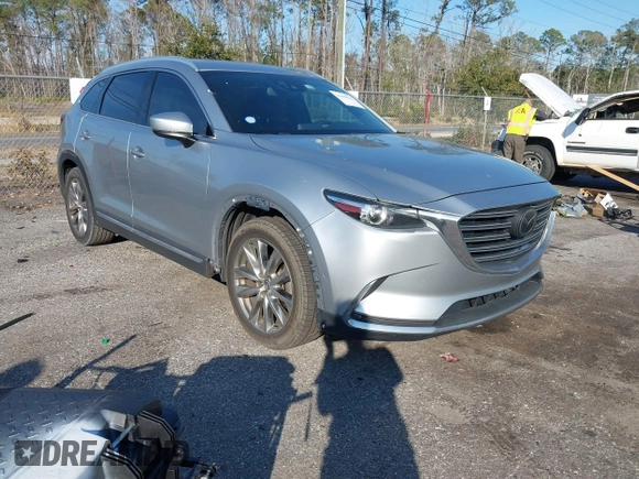 2017 Mazda CX-9 Grand Touring with VIN JM3TCADY5H0138176, listed as a IAAI auction lot 41458610 with 114,664 mi miles and . Bid and sale history available at DreamBid. Image 1.