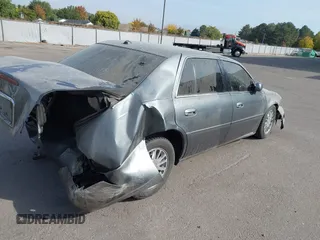 2004 Cadillac DeVille DHS z VIN 1G6KE57Y74U119605, wystawiony jako IAAI lot #40555057 z przebiegiem Nie podano mil oraz . Historia ofert i sprzedaży dostępna na DreamBid. Obrazek 4.