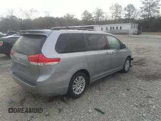 2014 Toyota Sienna XLE with VIN 5TDYK3DC0ES421501, listed as a IAAI auction lot 41672414 with 111,911 mi miles. Bid and sale history available at carsss.com. Image 4.