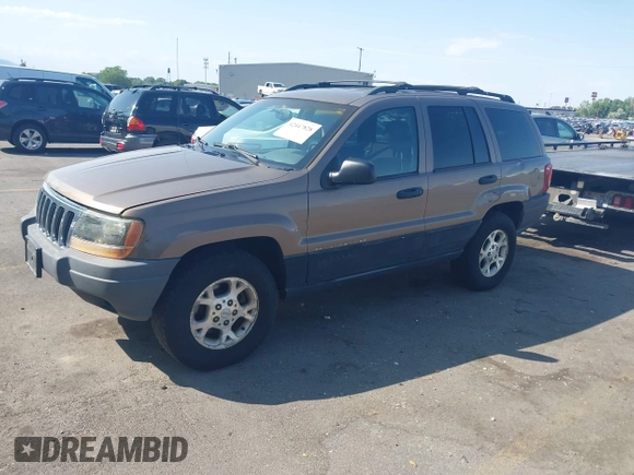 2001 Jeep Grand Cherokee Laredo with VIN 1J4GW48S81C694537, listed as a IAAI auction lot 42447828 with 162,981 mi miles and . Bid and sale history available at DreamBid. Image 2.