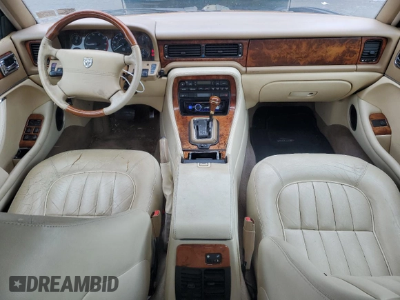 1996 Jaguar XJ with VIN SAJHX1741TC758740, listed as a Copart auction lot 73377914 with 140,964 mi miles and Salvage title. Bid and sale history available at DreamBid. Image 8.