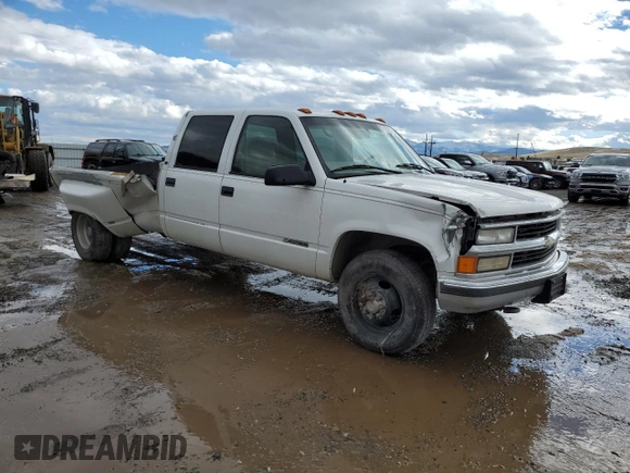 1999 Chevrolet Silverado 3500 z VIN 1GCHC33J2XF087634, wystawiony jako Copart lot #58106714 z przebiegiem 205 431 mil mil oraz Czysty tytuł • Clean title. Historia ofert i sprzedaży dostępna na DreamBid. Obrazek 4.