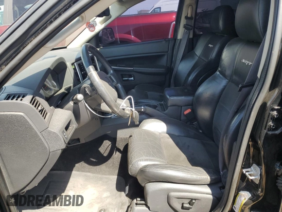 2008 Jeep Grand Cherokee SRT-8 with VIN 1J8HR78308C174606, listed as a Copart auction lot 70313584 with 169,765 mi miles and Salvage Title. Bid and sale history available at carsss.com. Image 7.