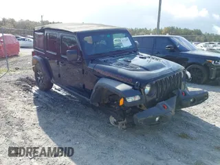 2021 Jeep Wrangler Unlimited Rubicon with VIN 1C4HJXFN0MW713057, listed as a IAAI auction lot 41773485 with 52,480 mi miles. Bid and sale history available at carsss.com. Image 1.