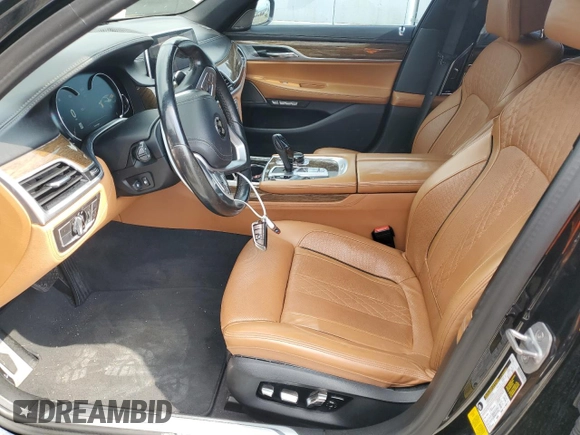 2016 BMW 7 Series 750i with VIN WBA7F0C53GGM20760, listed as a Copart auction lot 57230334 with 77,588 mi miles and Salvage Title. Bid and sale history available at carsss.com. Image 7.