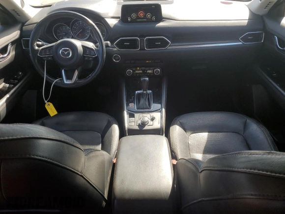 2018 Mazda CX-5 Grand Touring с VIN JM3KFADM2J1310339, выставлен на аукционе Copart как лот 64705245 с пробегом 63 927 миль миль и Списание • Salvage title. История ставок и продаж доступна на DreamBid. Изображение 8.
