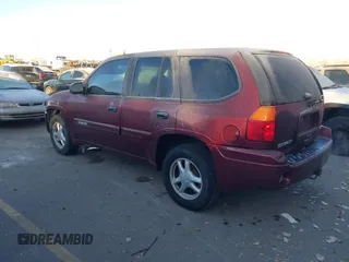 2005 GMC Envoy SLT with VIN 1GKDT13S452115924, listed as a IAAI auction lot 41443704 with 215,402 mi miles. Bid and sale history available at carsss.com. Image 3.