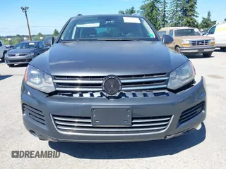 2012 Volkswagen Touareg Sport with VIN WVGFK9BP0CD004951, listed as a IAAI auction lot 42724125 with 173,993 mi miles and . Bid and sale history available at DreamBid. Image 12.