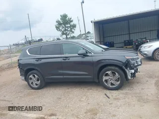 2021 Hyundai Santa Fe SE with VIN 5NMS14AJ5MH346250, listed as a IAAI auction lot 42299607 with 50,643 mi miles and . Bid and sale history available at DreamBid. Image 14.