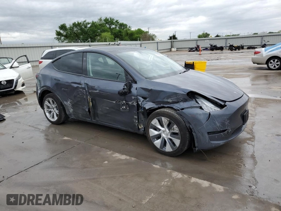 2023 Tesla Model Y Long Range with VIN 7SAYGDEE3PA151887, listed as a Copart auction lot 51459495 with 15,562 mi miles and Salvage Title. Bid and sale history available at DreamBid. Image 4.