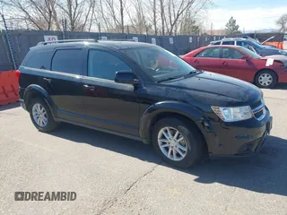 2016 Dodge Journey SXT with VIN 3C4PDDBG3GT215910, listed as a IAAI auction lot 41798779 with 165,505 mi miles. Bid and sale history available at carsss.com. Image 1.