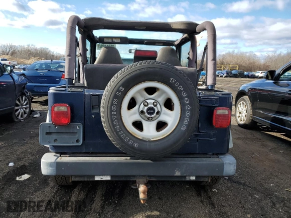 2000 Jeep Wrangler Sport with VIN 1J4FA49S2YP803165, listed as a Copart auction lot 85611904 with 192,427 mi miles and Non repairable. Bid and sale history available at DreamBid. Image 6.