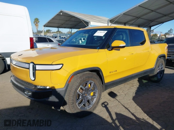 2022 Rivian R1T Adventure Package with VIN 7FCTGAAA2NN005811, listed as a IAAI auction lot 41706558 with 21,336 mi miles. Bid and sale history available at carsss.com. Image 2.