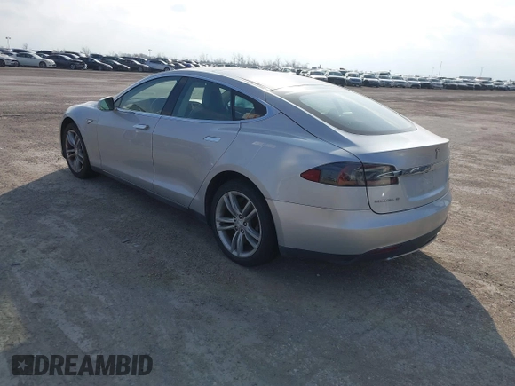 2013 Tesla Model S with VIN 5YJSA1CG3DFP28908, listed as a IAAI auction lot 41804041 with 140,756 mi miles and . Bid and sale history available at DreamBid. Image 3.