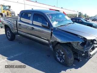 2014 Toyota Tacoma with VIN 3TMMU4FN1EM069638, listed as a IAAI auction lot 42074567 with 113,791 mi miles and . Bid and sale history available at DreamBid. Image 1.