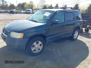 2003 Ford Escape XLT Popular 2 with VIN 1FMYU93113KB33578, listed as a IAAI auction lot 41985463 with 103,500 mi miles and . Bid and sale history available at DreamBid. Image 2.
