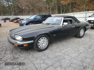 1996 Jaguar XJS with VIN SAJNX2740TC225643, listed as a Copart auction lot 80975784 with 98,427 mi miles and Salvage Title. Bid and sale history available at carsss.com. Image 1.