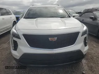 2022 Cadillac XT4 FWD Sport z VIN 1GYFZER44NF118862, wystawiony jako Copart lot #75053034 z przebiegiem 14 983 mil mil oraz Nie do naprawy • Non repairable. Historia ofert i sprzedaży dostępna na DreamBid. Obrazek 5.