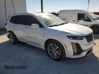 2024 Cadillac XT6 FWD Premium Luxury with VIN 1GYKPCRS4RZ742995, listed as a Copart auction lot 82802774 with 5,898 mi miles and Salvage Title. Bid and sale history available at carsss.com. Image 4.