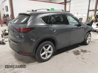 2020 Mazda CX-5 Grand Touring with VIN JM3KFBDM3L0739763, listed as a IAAI auction lot 41751250 with 88,063 mi miles and . Bid and sale history available at carsss.com. Image 4.