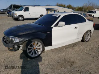 2010 BMW 1 Series 128i with VIN WBAUP9C54AVL89039, listed as a Copart auction lot 50907955 with 135,655 mi miles and Salvage Title. Bid and sale history available at carsss.com. Image 1.