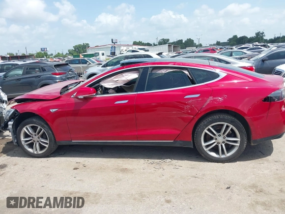2014 Tesla Model S 60 with VIN 5YJSA1H14EFP63897, listed as a IAAI auction lot 42713272 with Not provided miles and . Bid and sale history available at DreamBid. Image 13.