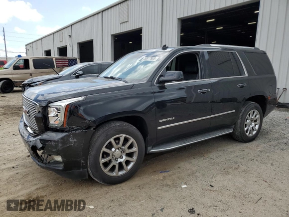 2015 GMC Yukon Denali with VIN 1GKS1CKJ0FR140877, listed as a Copart auction lot 50917985 with 180,726 mi miles and Salvage Title. Bid and sale history available at carsss.com. Image 1.