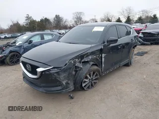 2017 Mazda CX-5 Grand Touring with VIN JM3KFBDL6H0179557, listed as a IAAI auction lot 41546493 with 103,585 mi miles. Bid and sale history available at carsss.com. Image 2.