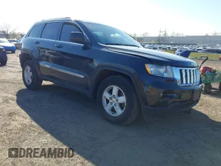 2012 Jeep Grand Cherokee Laredo with VIN 1C4RJFAG5CC118826, listed as a IAAI auction lot 42039801 with 158,153 mi miles. Bid and sale history available at carsss.com. Image 1.