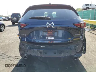 2021 Mazda CX-5 Grand Touring with VIN JM3KFBDM3M1344784, listed as a Copart auction lot 58051445 with 69,593 mi miles and Salvage title. Bid and sale history available at DreamBid. Image 6.