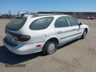 1996 Mercury Sable z VIN 1MELM55U0TG623025, wystawiony jako IAAI lot #42320328 z przebiegiem 235 325 mil mil oraz . Historia ofert i sprzedaży dostępna na DreamBid. Obrazek 4.