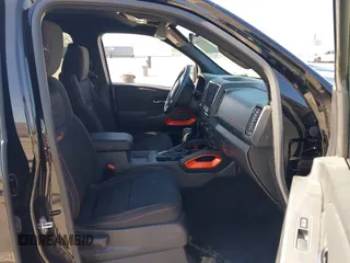 2024 Nissan Frontier SL with VIN 1N6ED1EJ4RN650125, listed as a IAAI auction lot 42193443 with 14,282 mi miles and . Bid and sale history available at DreamBid. Image 5.